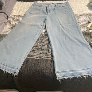 Wide leg jeans with raw hem.
